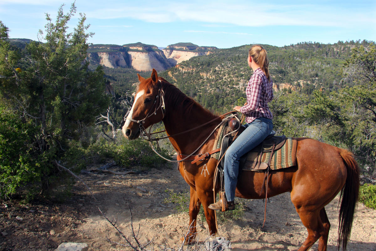 Woman on horseback during a horseback riding tour in Zion National Park