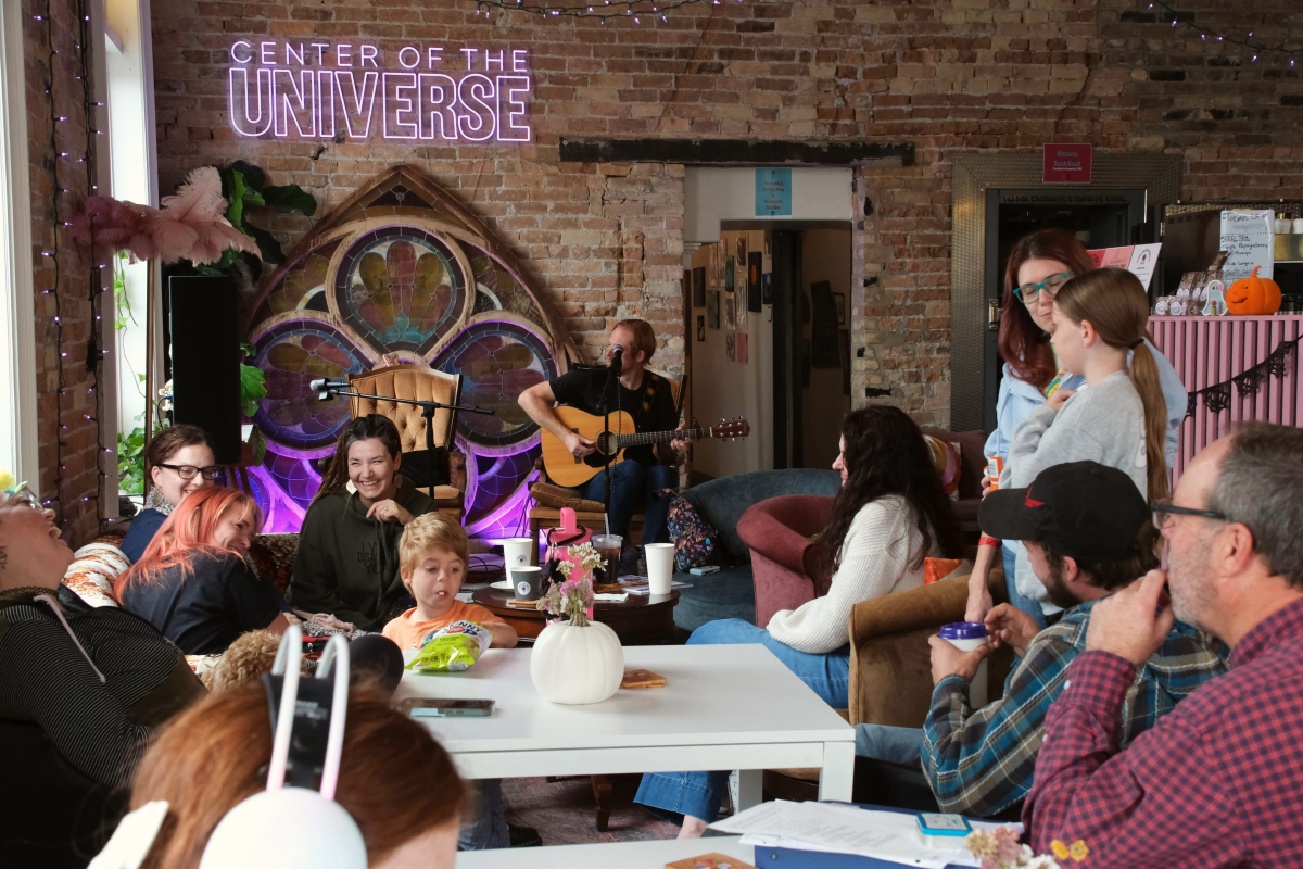 Photo of people playing music in local cafe