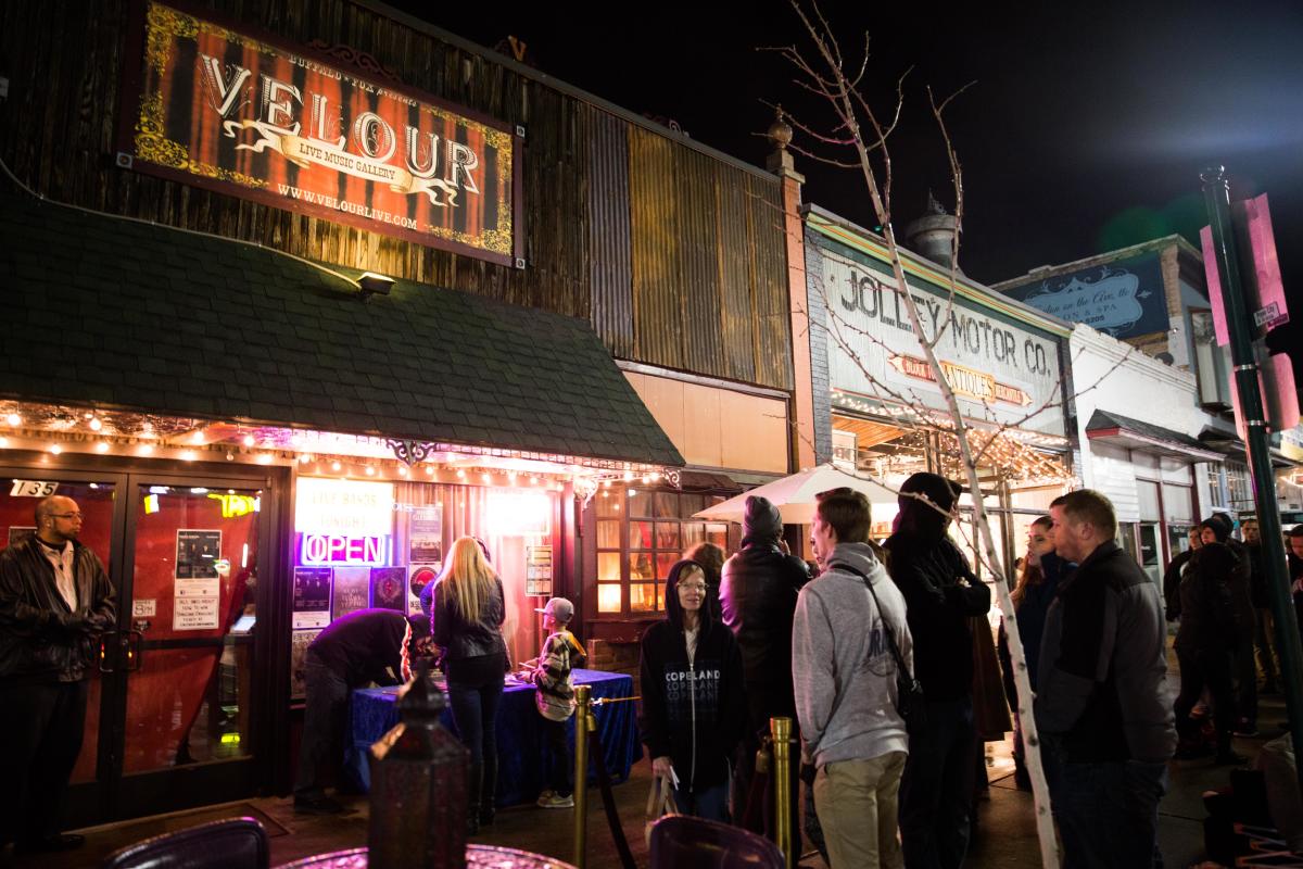 crowd lined up to enter Velour front doors