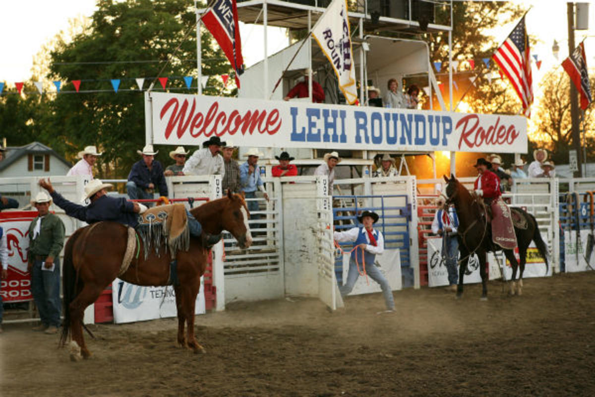 horses and riders in front of gate at Lehi Roundup rodeo