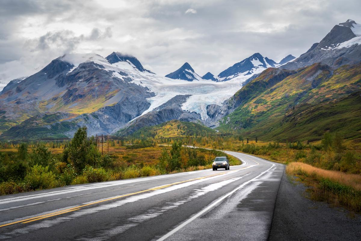 a vehicle on the Richardson Highway with Worthington Glacier in the background