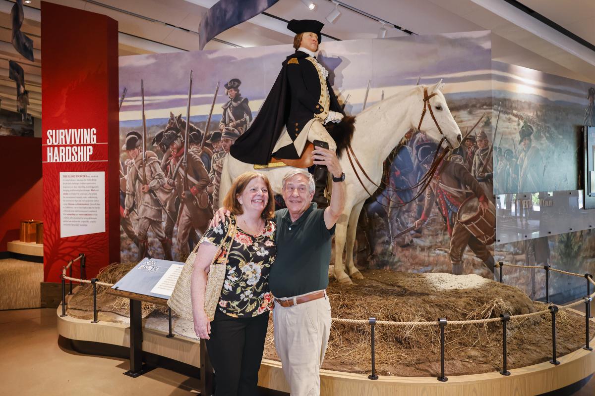 Senior citizen couple poses for a selfie in the Visitor Center at Valley Forge National Park