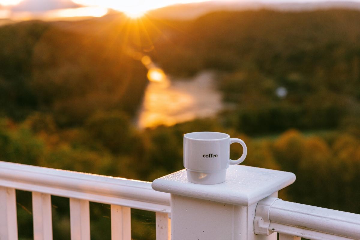 A cup of coffee and a stunning sunrise over the New River at the Lilly  Valley Inn in Pearisburg, Virginia