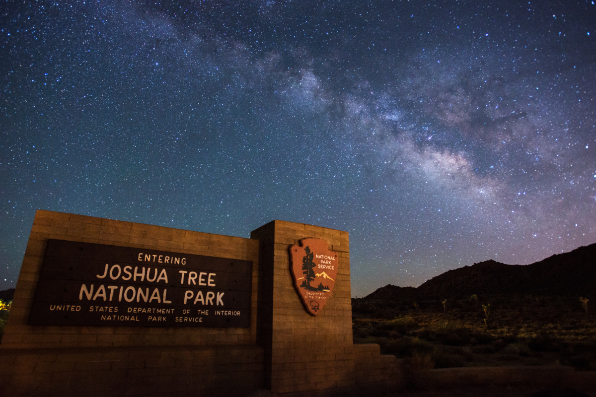 The Milky Way rises above the entrance sign of Joshua Tree National Park just outside Twentynine Palms, California.