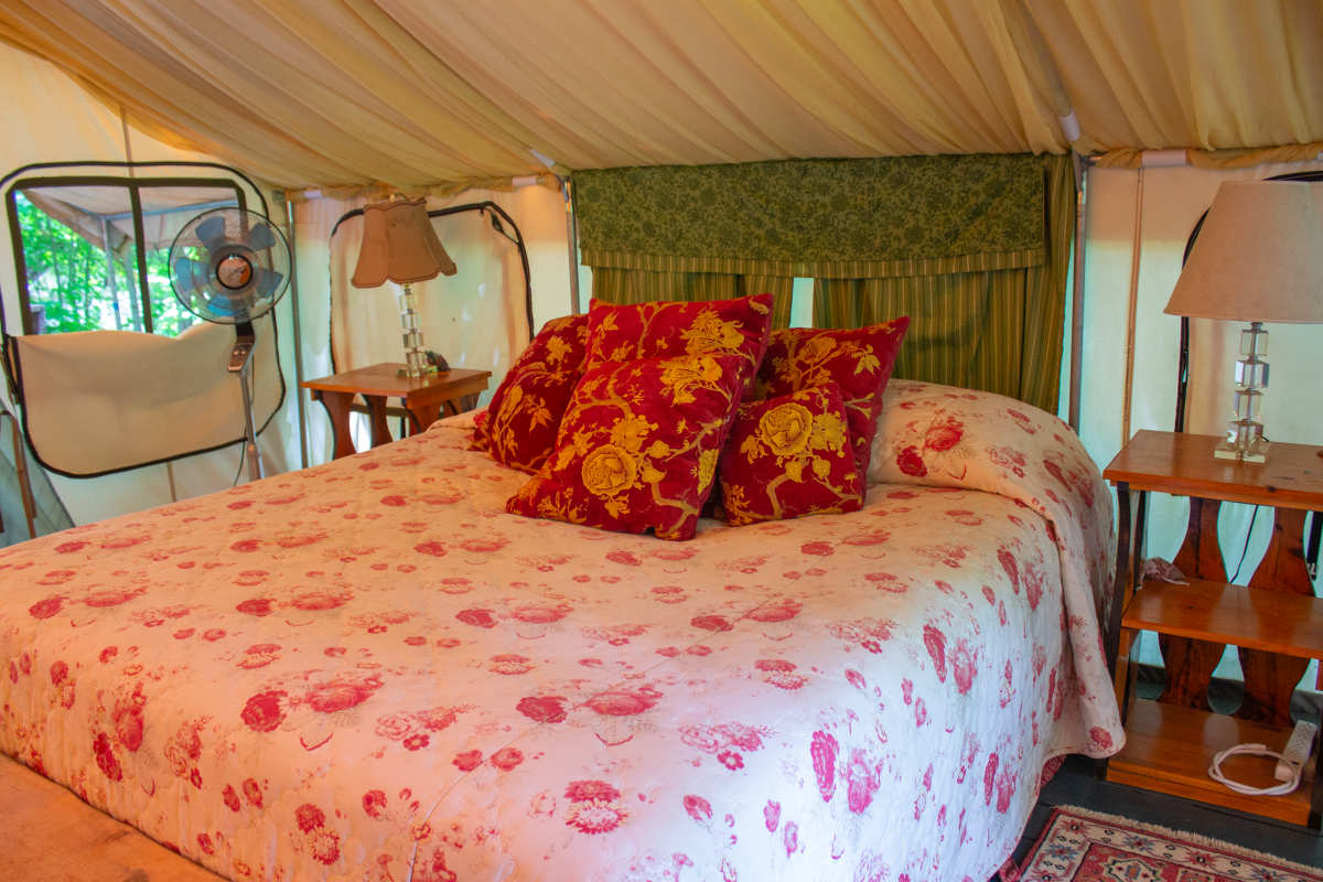 Bed Inside a Glamping Tent at North River Hobby Farm