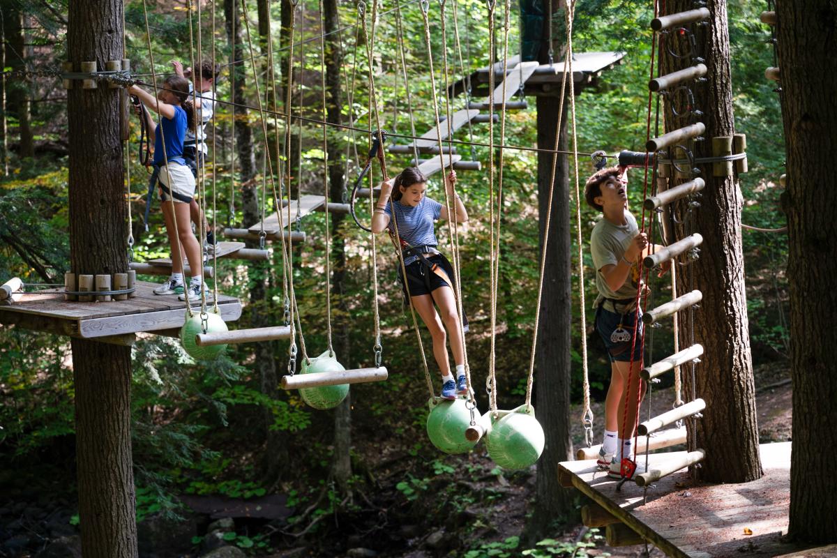 Kids going through an aerial course at Adirondack Extreme