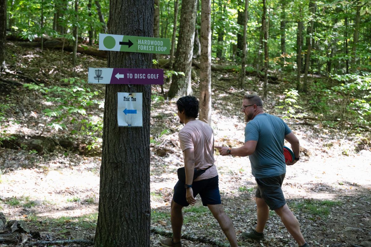 Adults playing disc golf at Gore Mountain