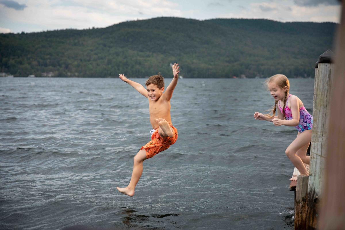 Two Kids Swimming in the Lake