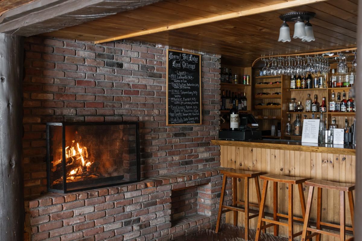 Fireplace and bar inside Garnet Hill Lodge