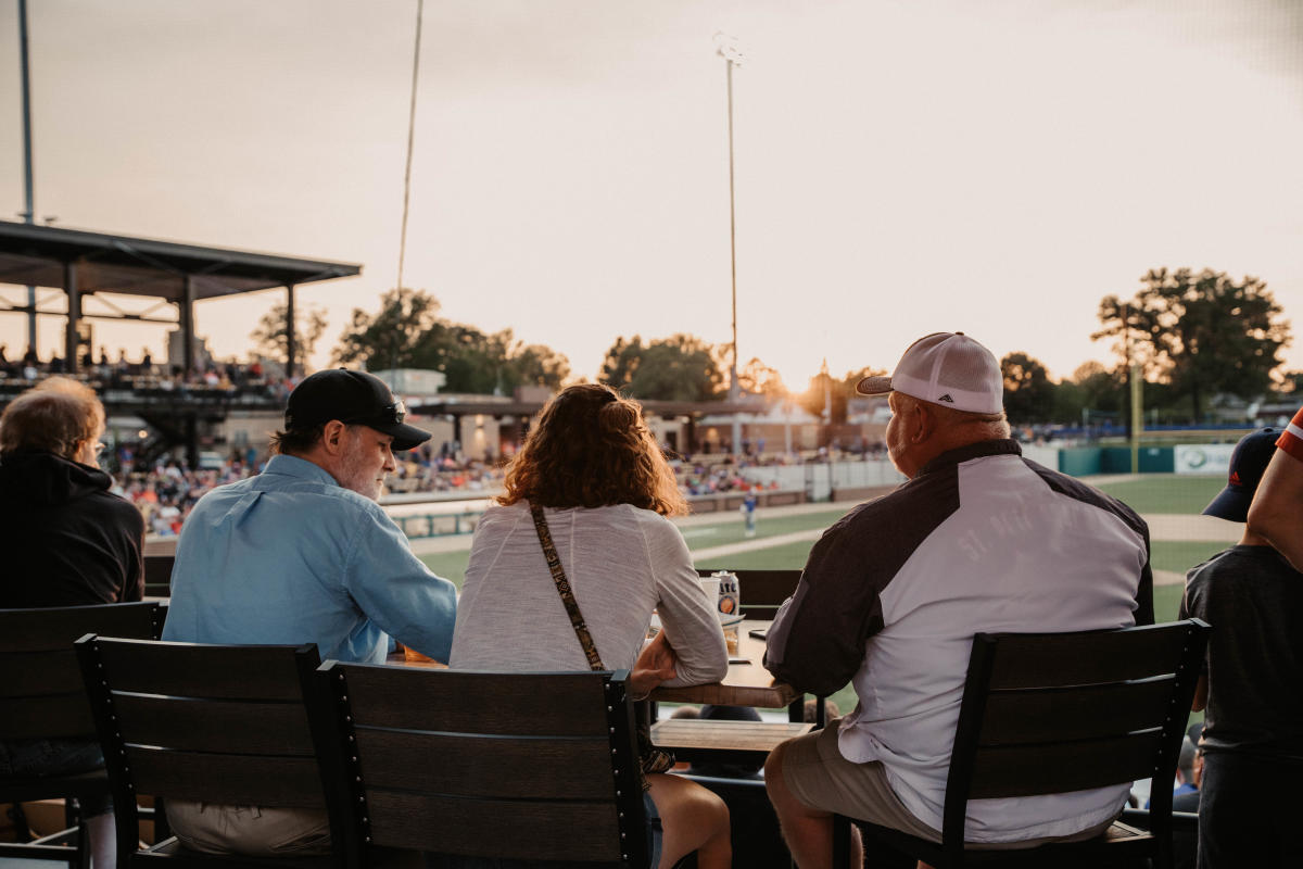 Aviators fans sitting at table