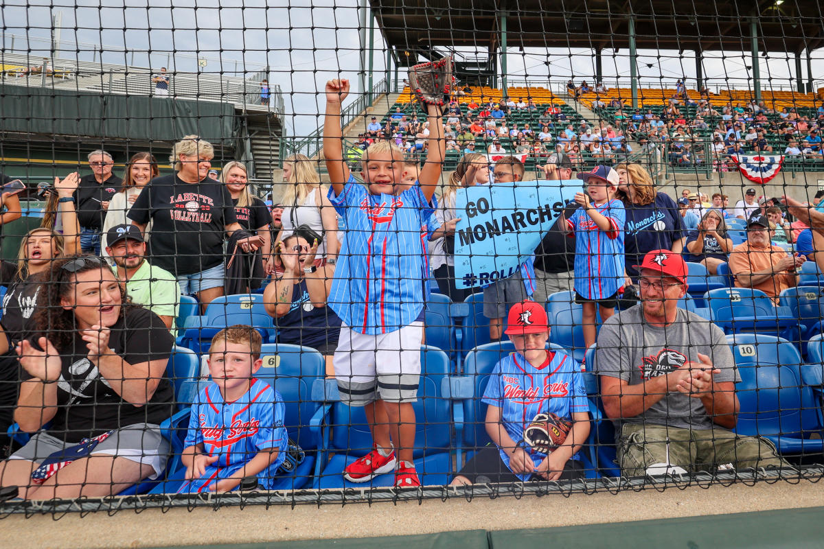 Fans cheer in the stands during a game at Eck Stadium during the NBC World Series