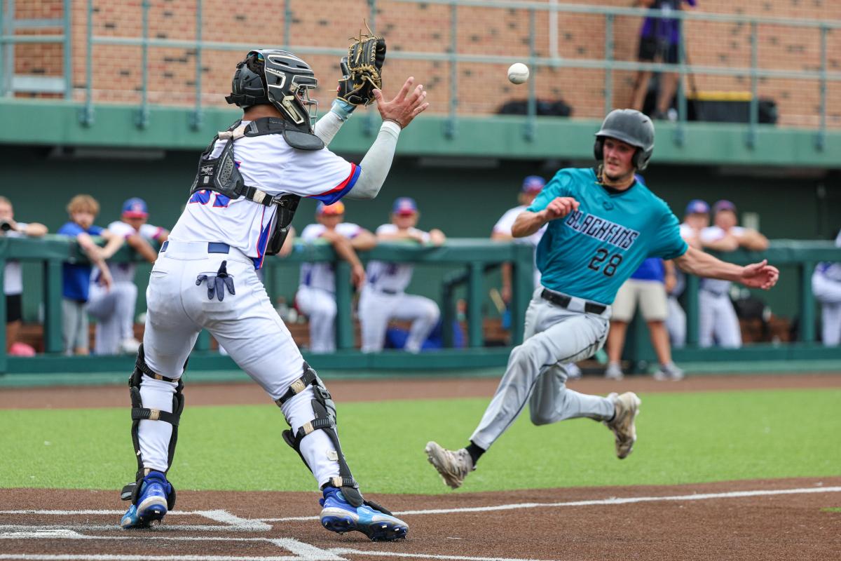 A college baseball player runs toward home plate during a NBC World Series game in Wichita.