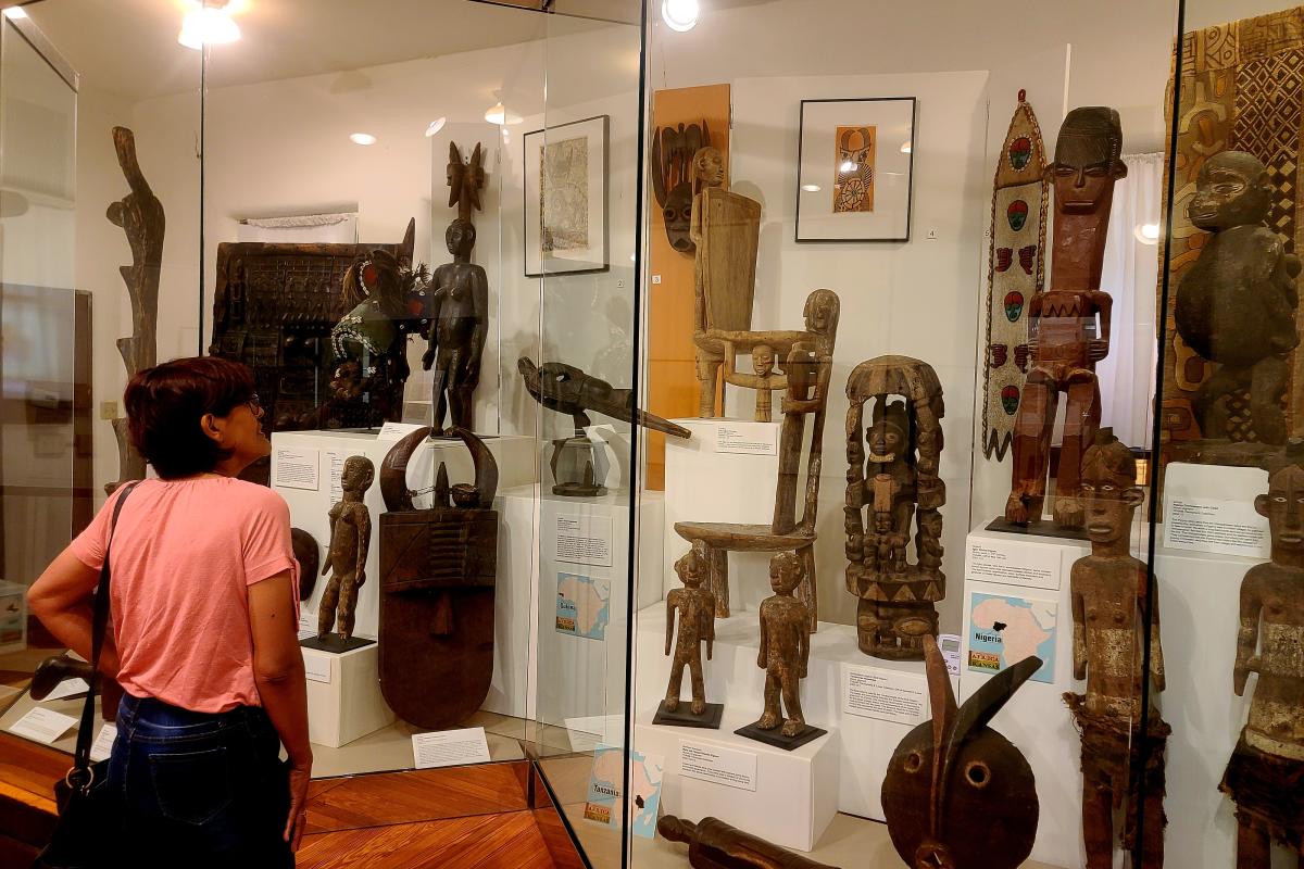A woman looks at artifacts on display at the Kansas African American Museum