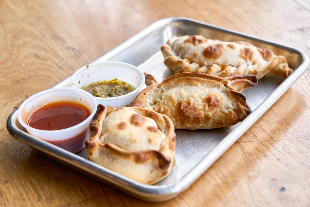 A platter features three empanadas at Argentina's Empanadas photographed by Darrin Hackney