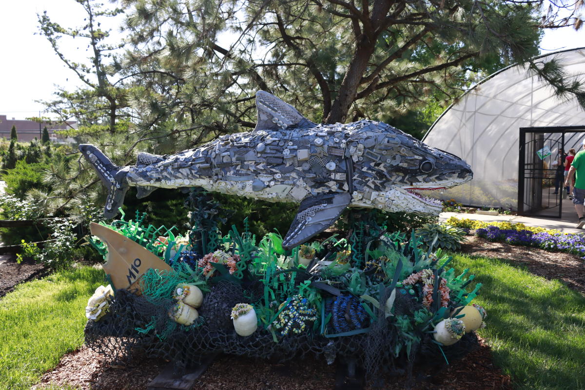 Chompers the Shark sculpture made of marine debris sits on display at Botanica Wichita