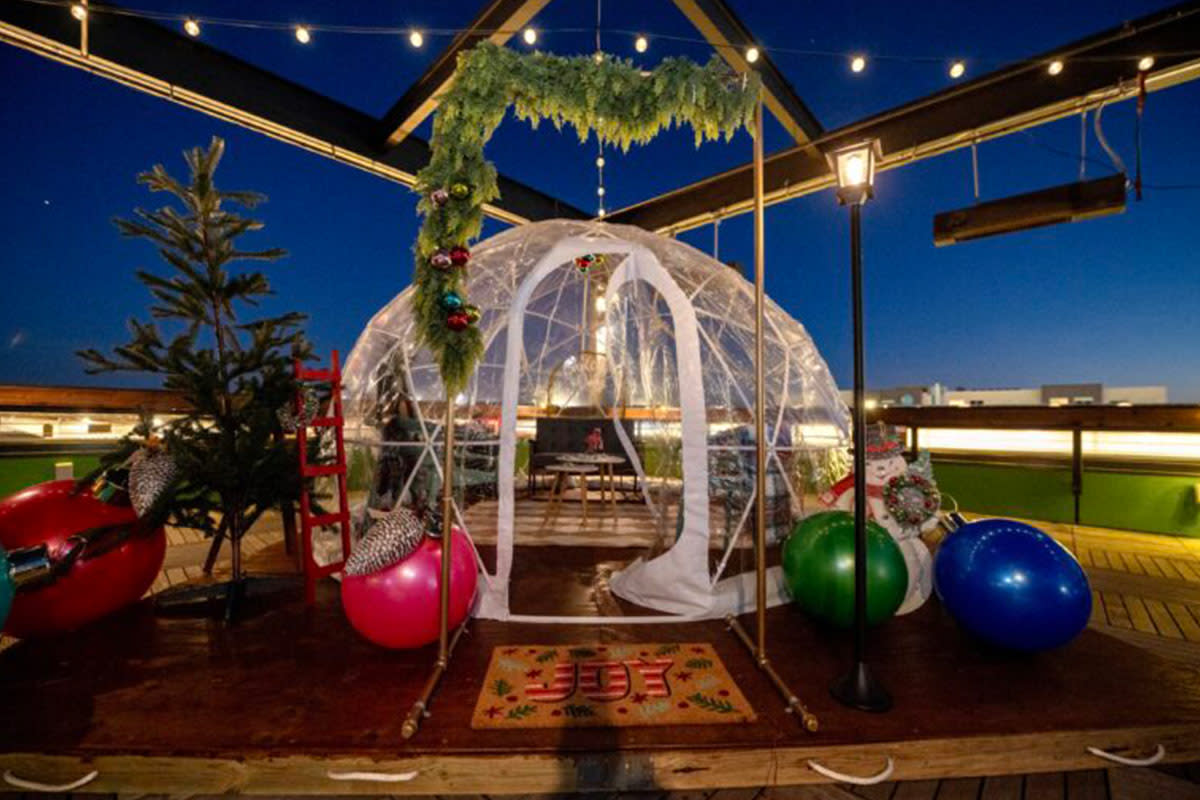 An Igloo is decorated for the holidays at Chicken N Pickle