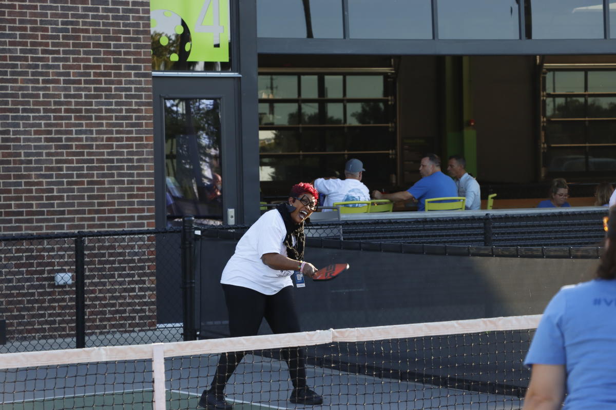 A woman plays pickleball at Chicken N Pickle