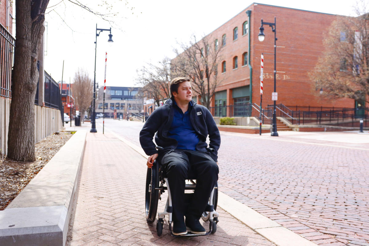 Hunter Vance travels on the brick roads of Old Town in his wheelchair