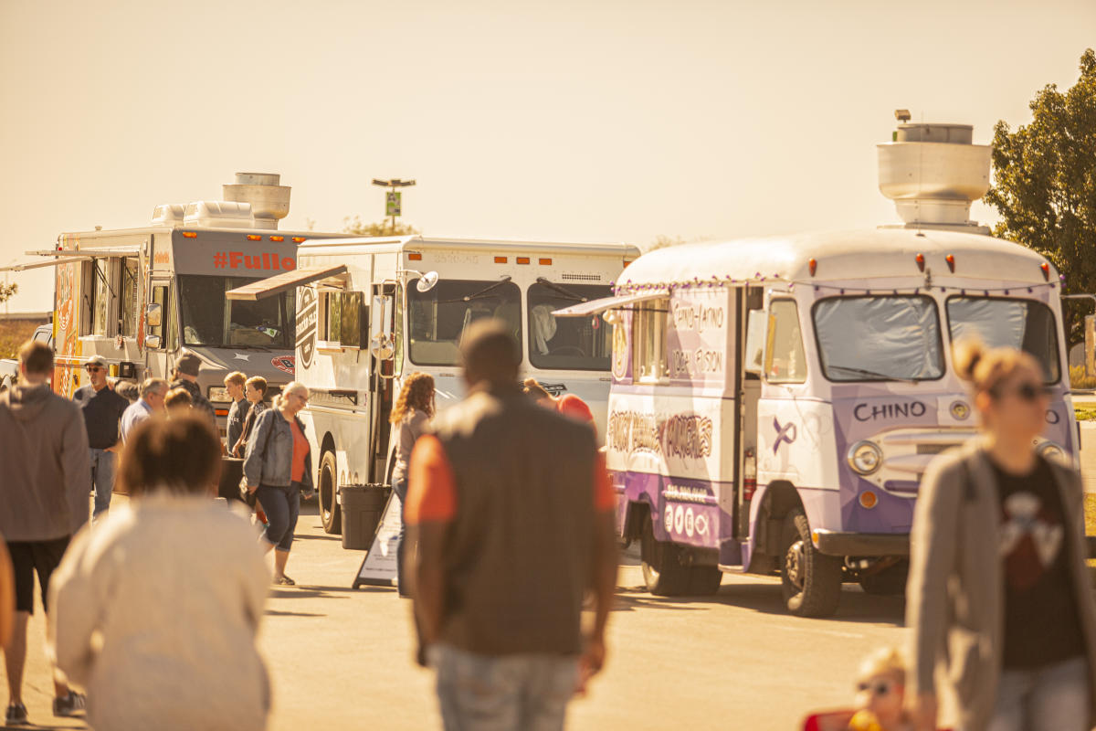 Food trucks line up to serve customers