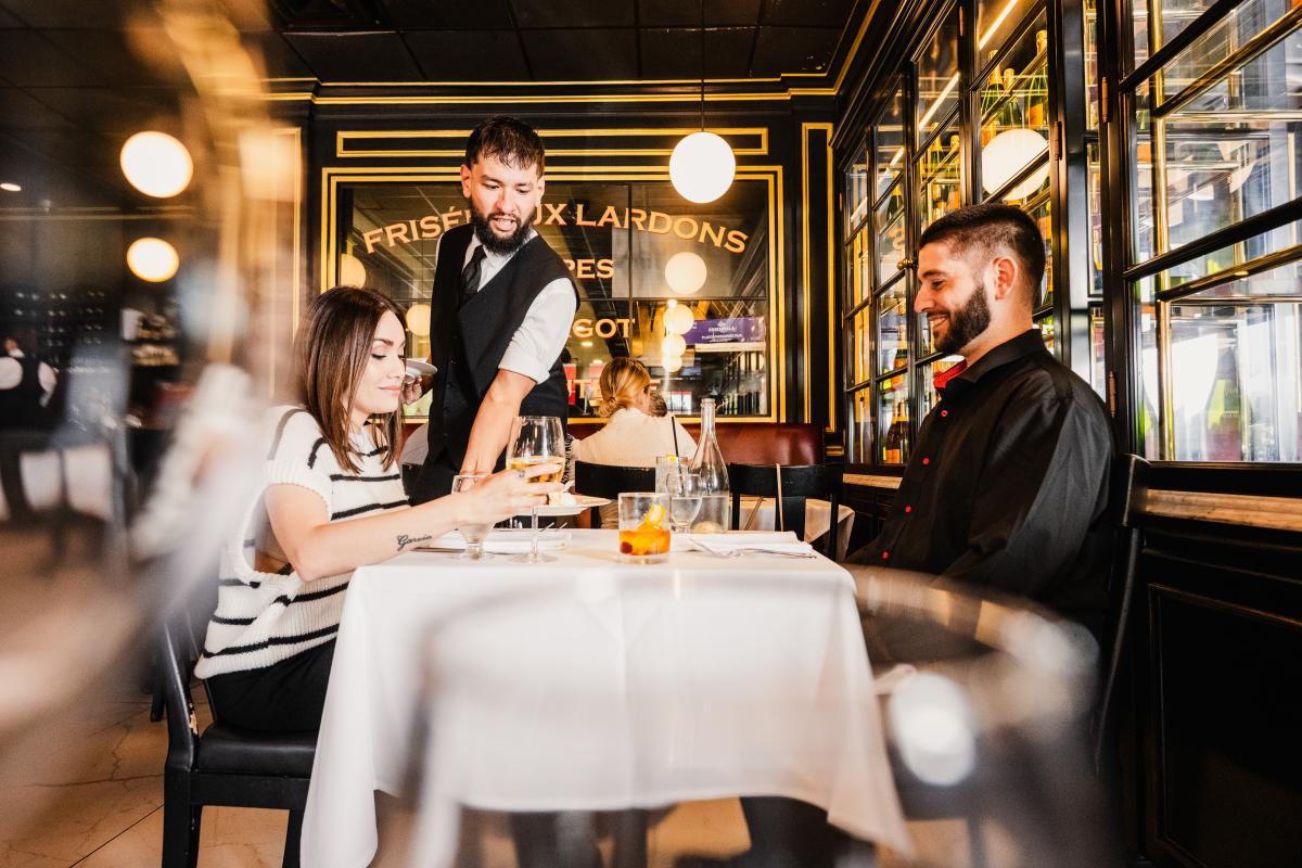 A man and woman enjoy a meal at Georges French Bistro, a James Beard Finalist, in Wichita.
