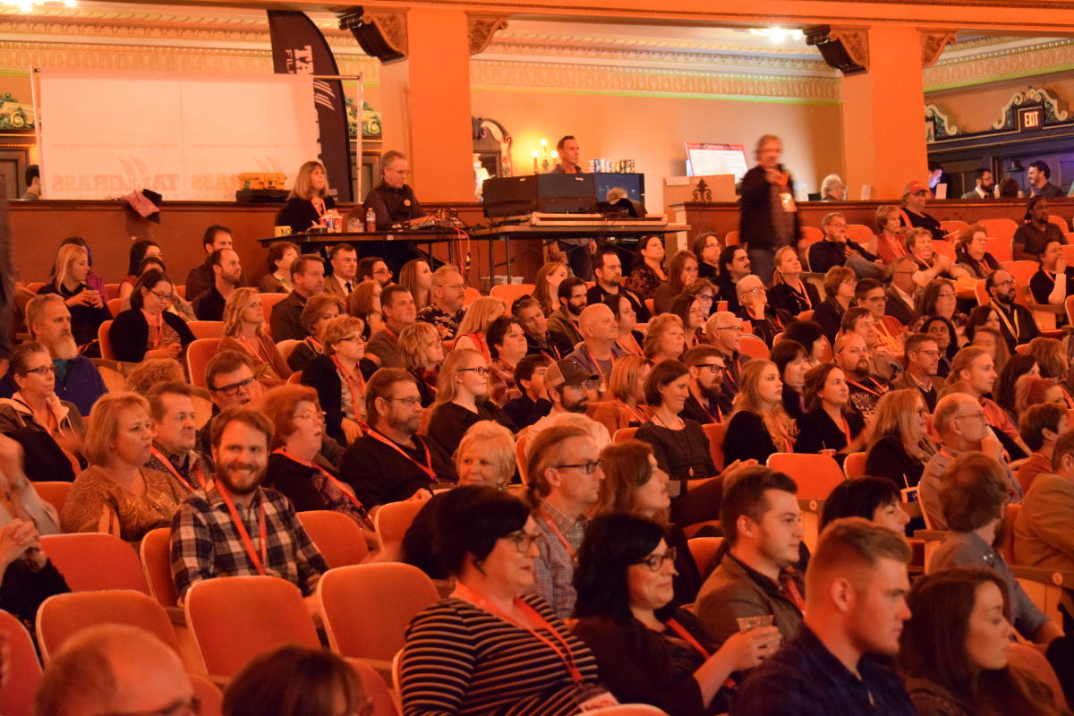 A crowd prepares to watch a film screening inside Orpheum Theatre during the Tallgrass Film Festival