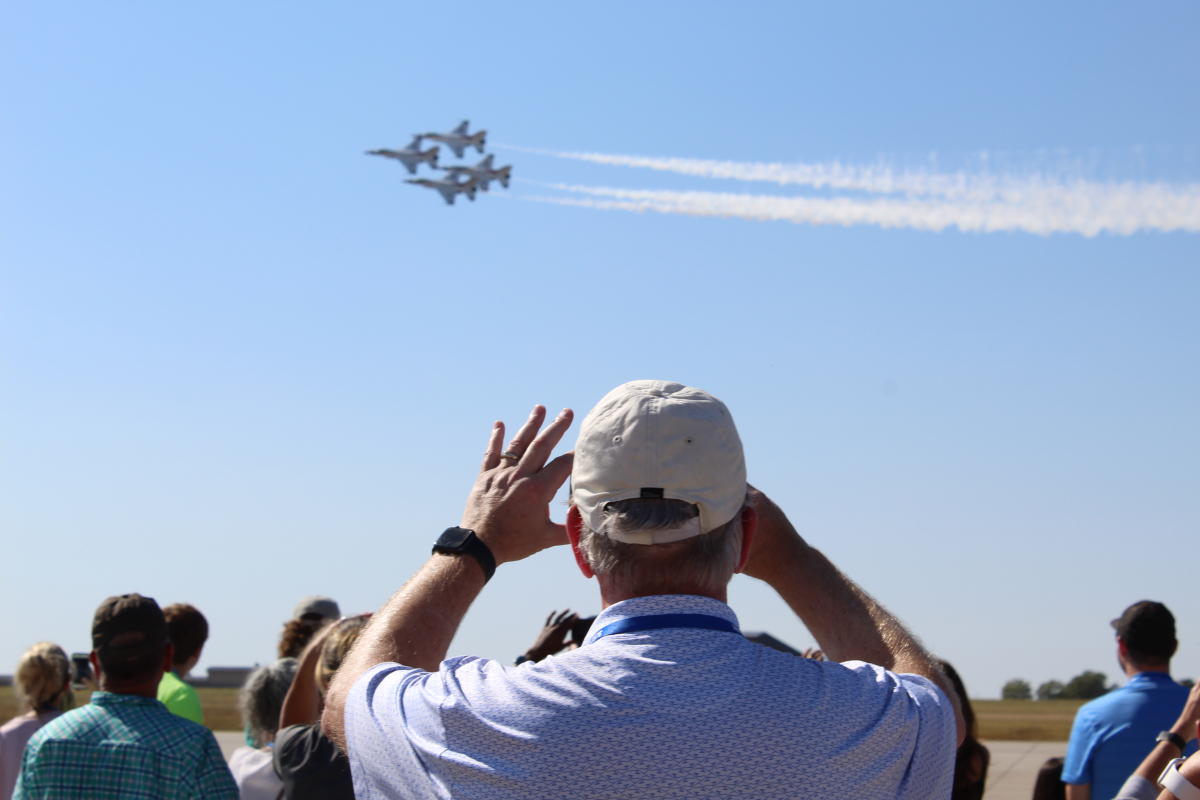 A man takes a photo of the U.S. Air Force Thunderbirds during the Air Show