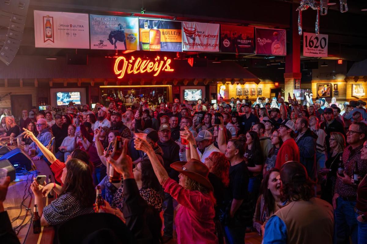Patrons enjoy drinks and dancing during a concert at Gilley's Gambling Hall