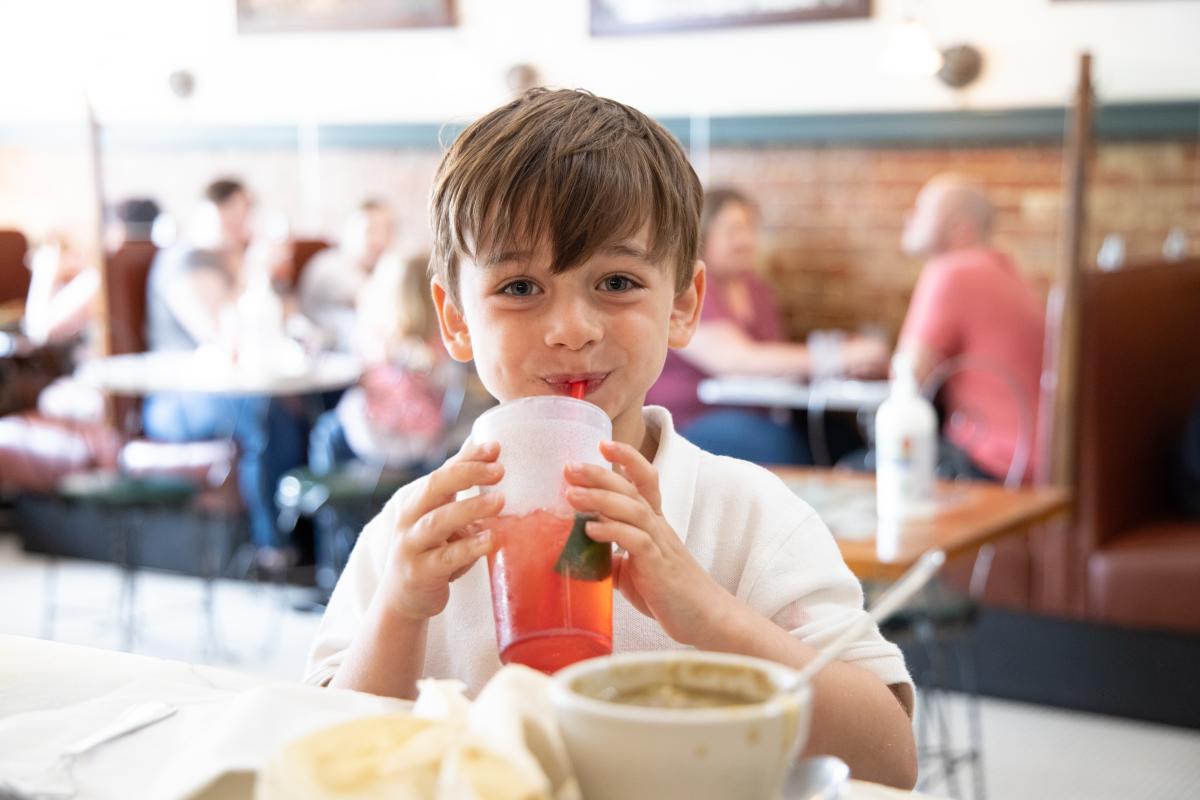 A young boy sips on a soda found at Old Mill Tasty Shop in Wichita