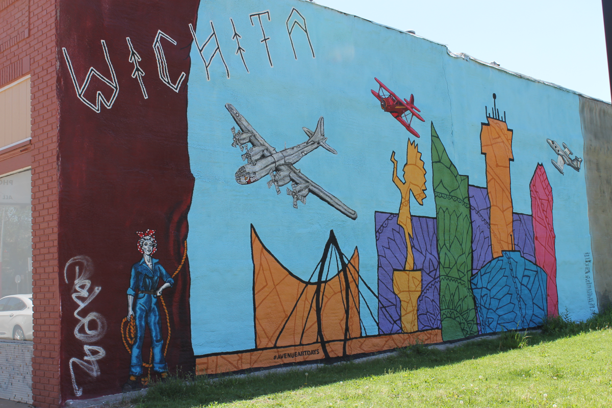 A mural painted on the exterior of a Wichita building features several airplanes
