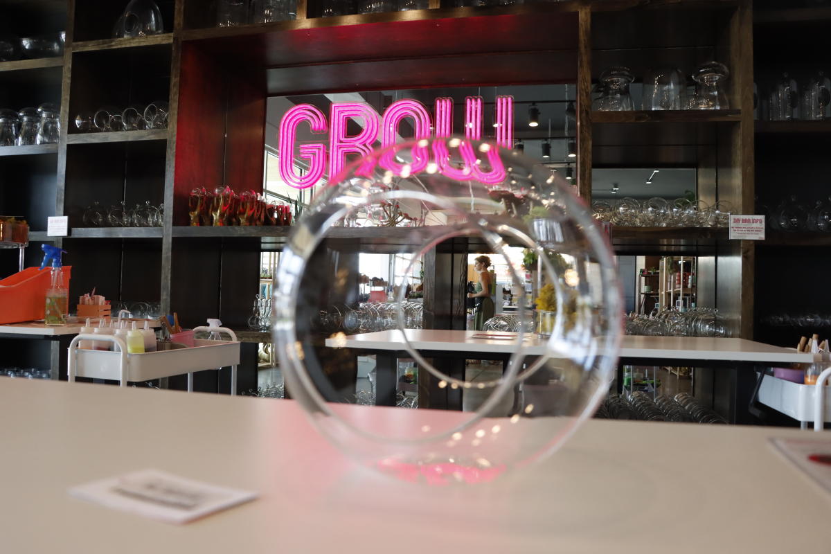 An empty terrarium sits on a table at Grow Giesen Plant Shop/Botanic in Wichita