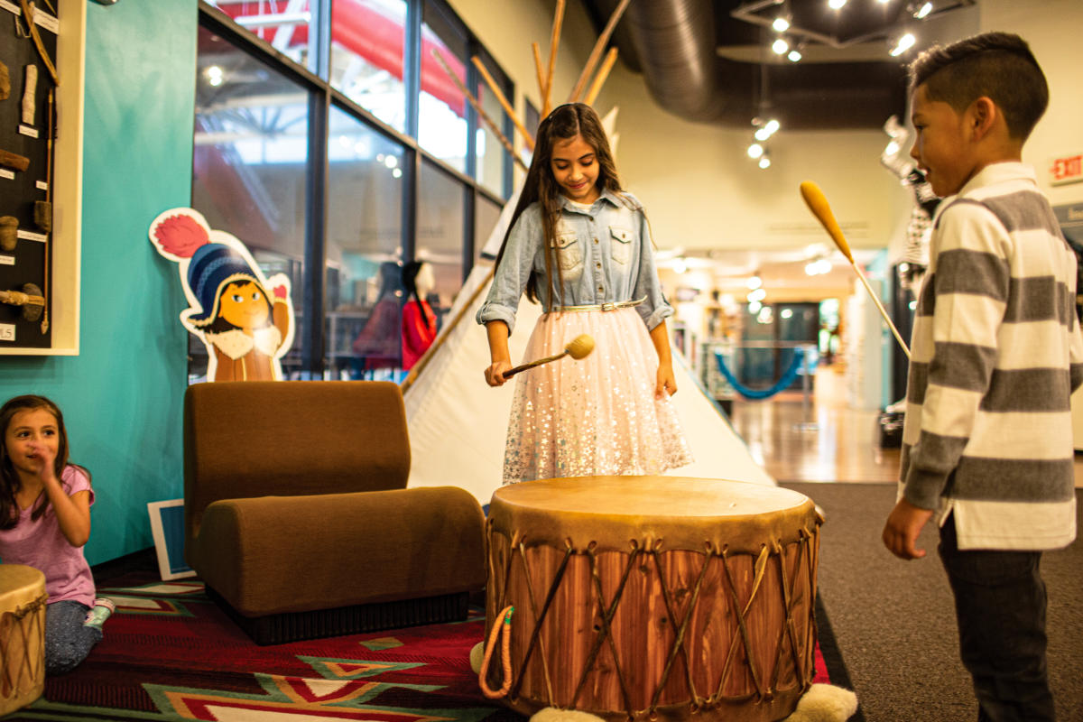 A family explores the Mid-American All Indian Musem exhibits