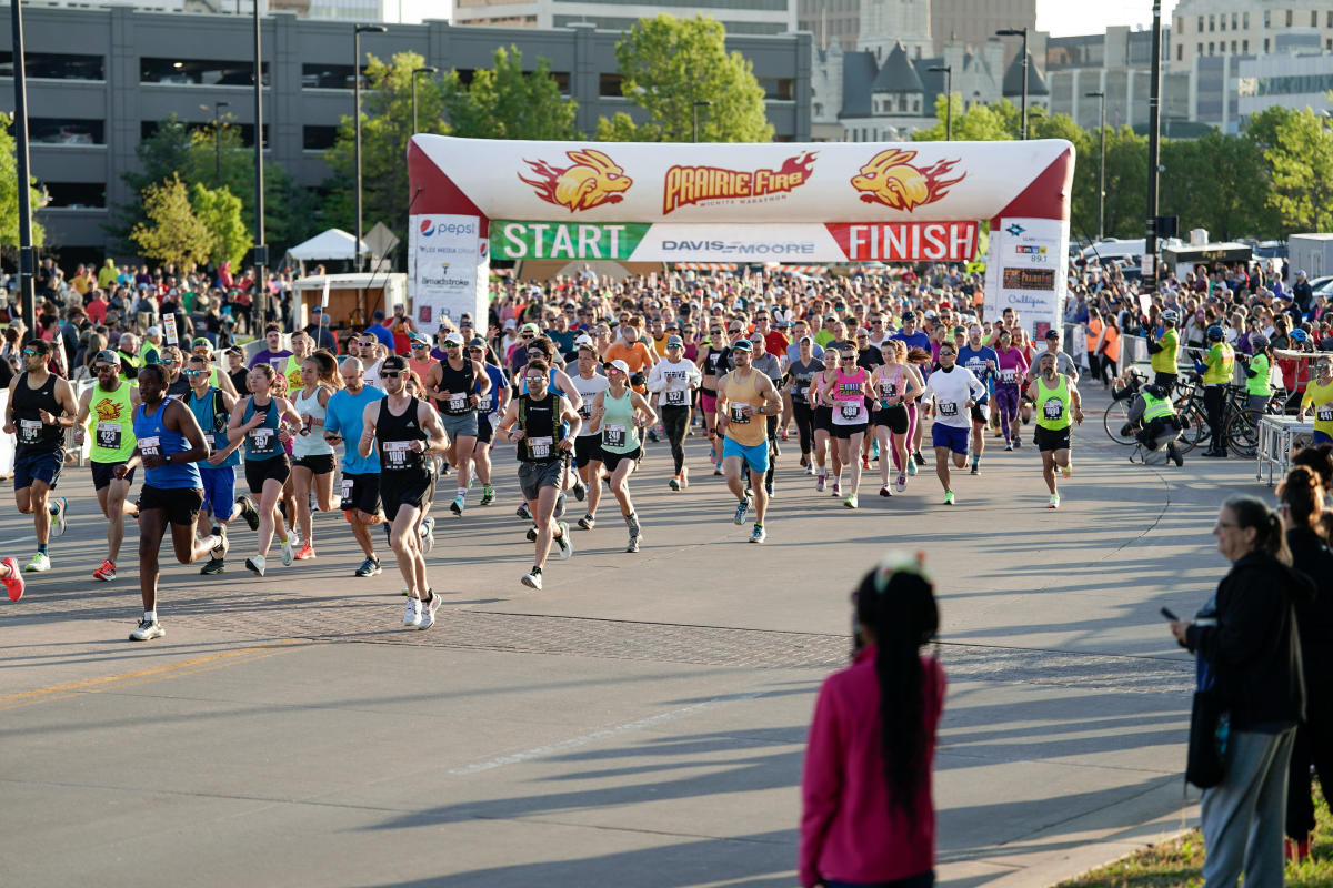 Runners begin running the Prairie Fire Marathon in downtown Wichita