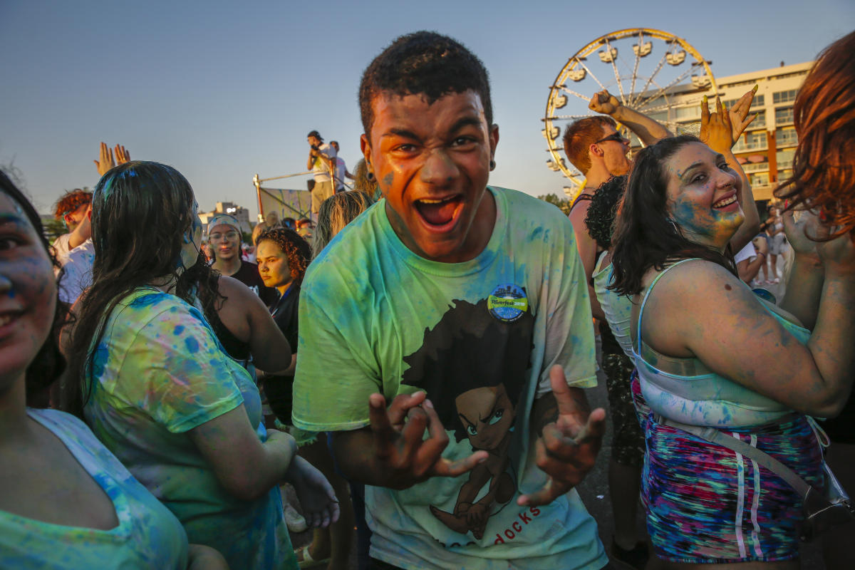 A teenage boy shouts with excitement during the carnival at Wichita Riverfest