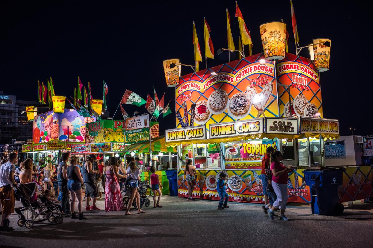 Festival goers line up outside food vendors at the Riverfest Food Court