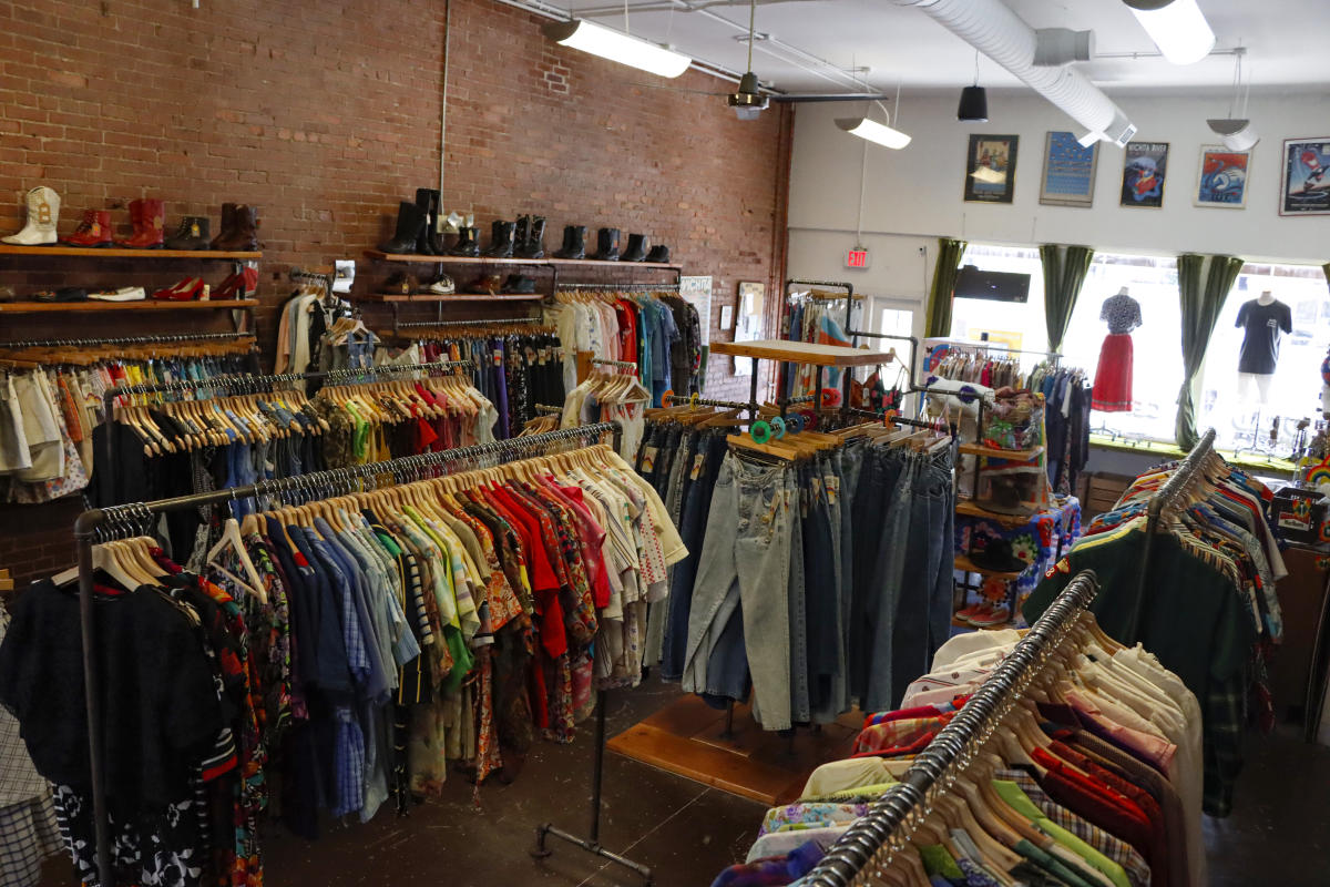 Clothing is hung on racks at Dead Center Vintage in Wichita