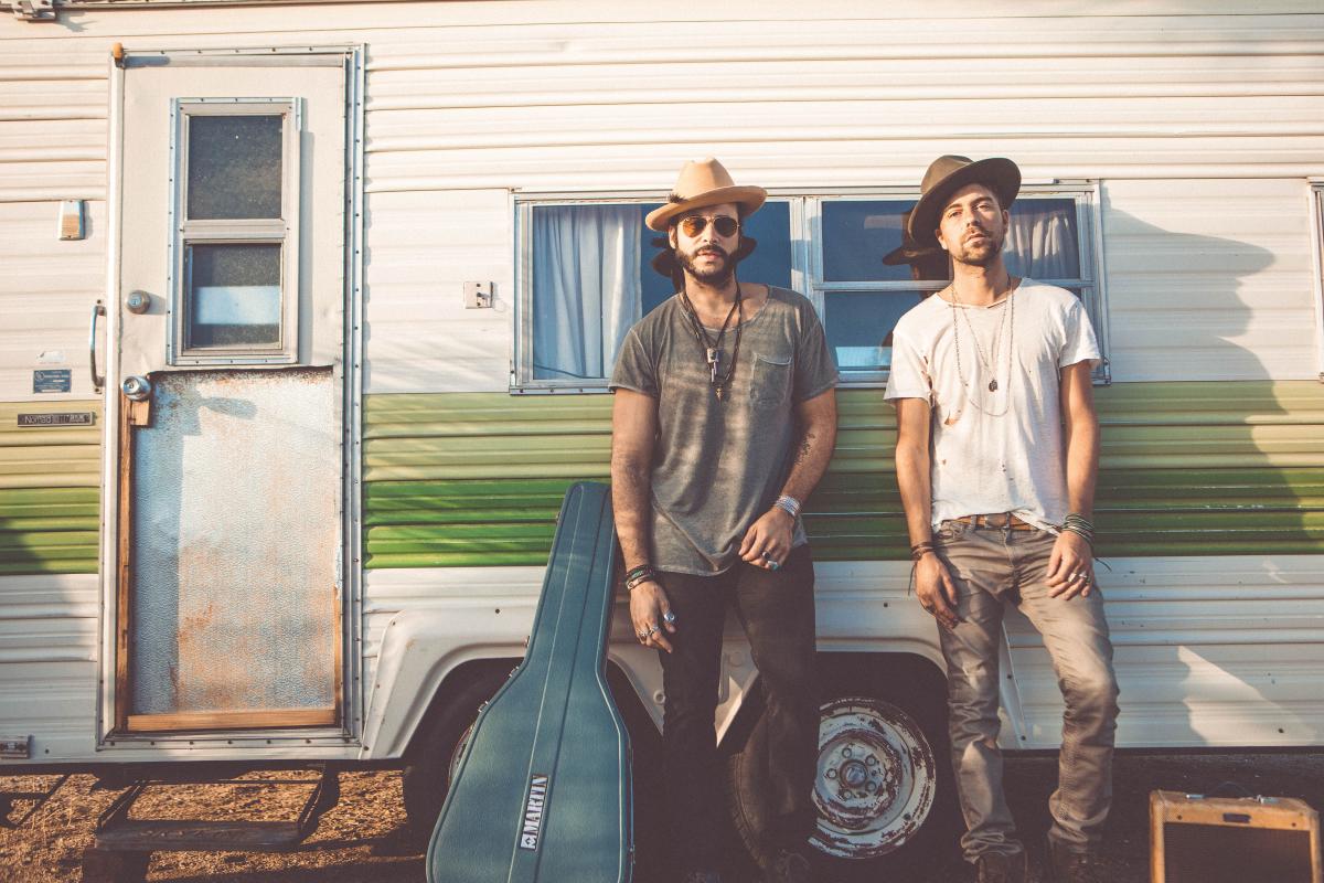The members of Sons of Legion pose out in front of an RV