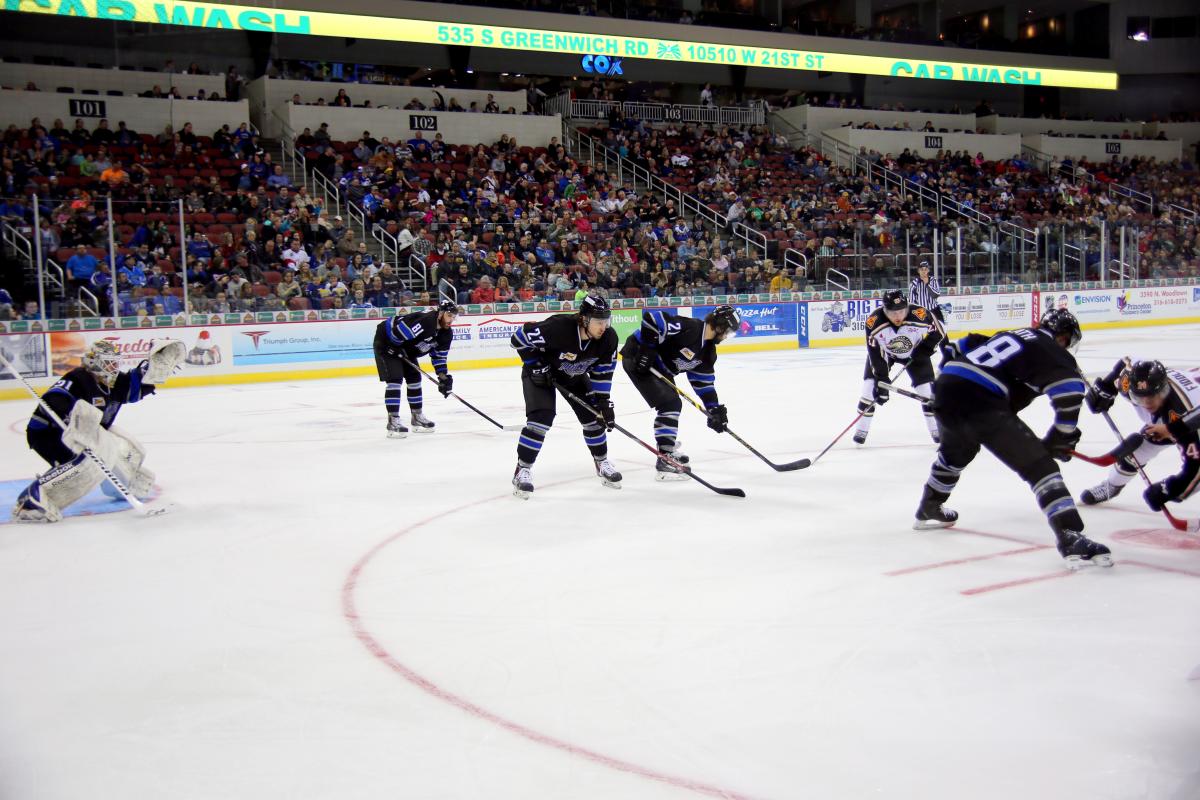 Players of the wichita Thunder hockey team play on the ice