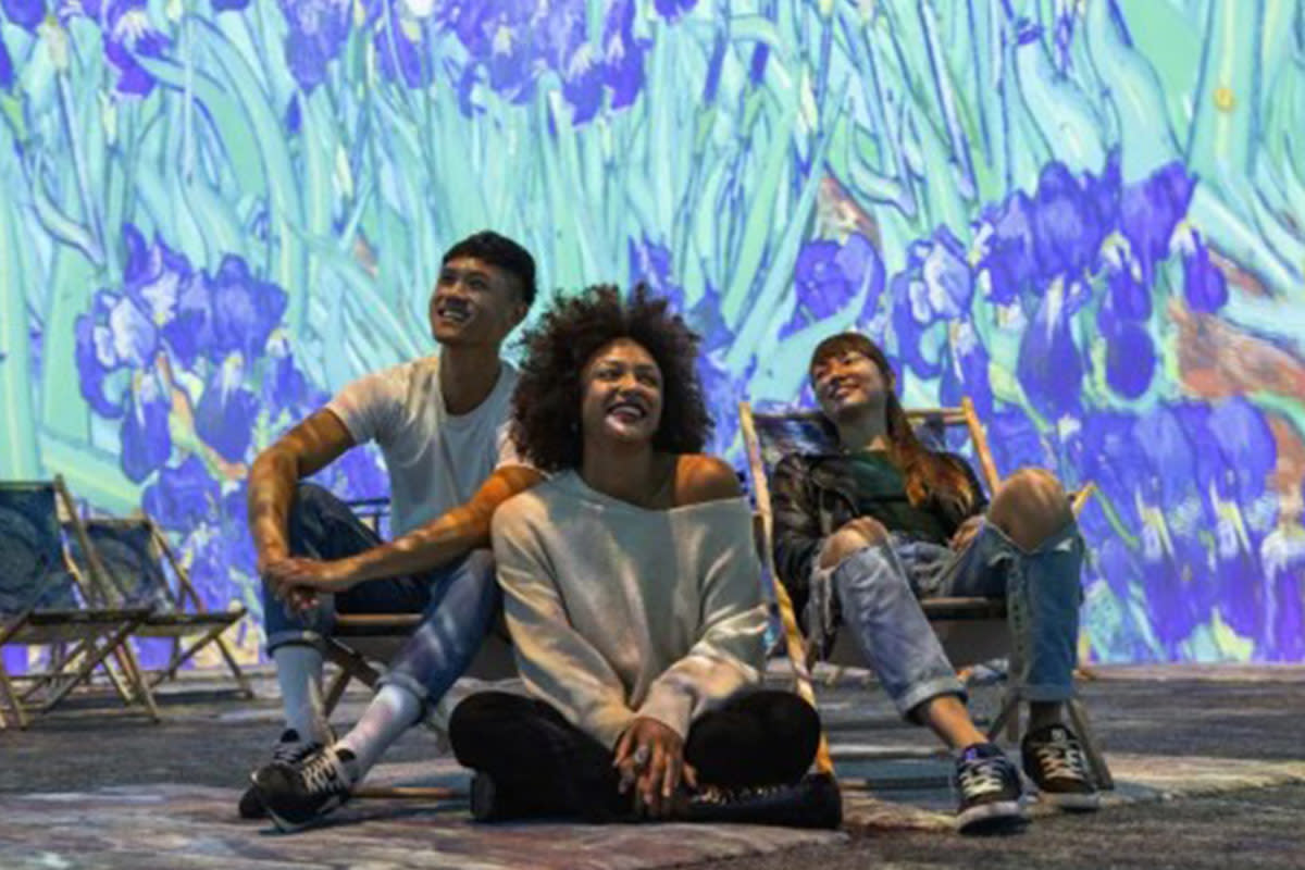People enjoy the Van Gogh Immersive Experience exhibit