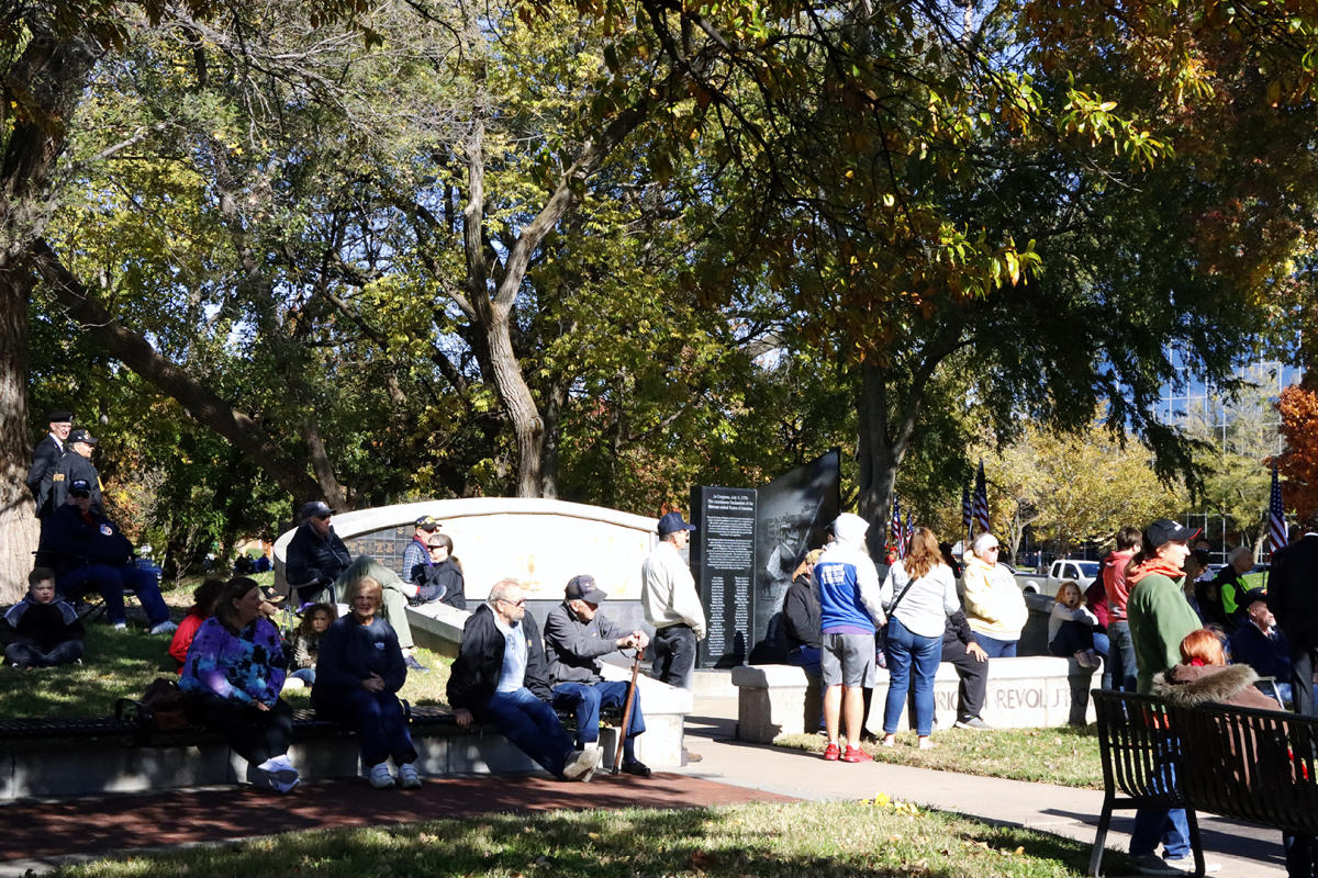 Visitors attend services at Veterans Memorial Park in downtown Wichita