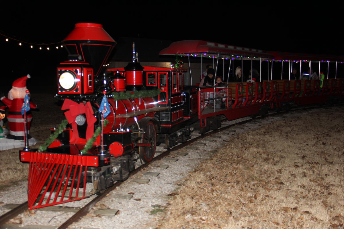 A train is decorated for Christmas with children on board at O.J. Watson Park