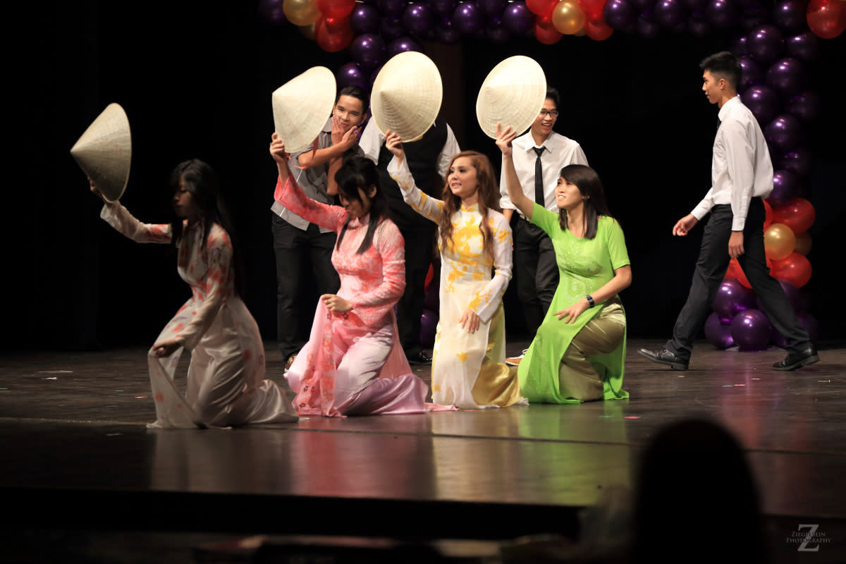 Dances bow with hats at Wichita Asian Festival in Wichita KS