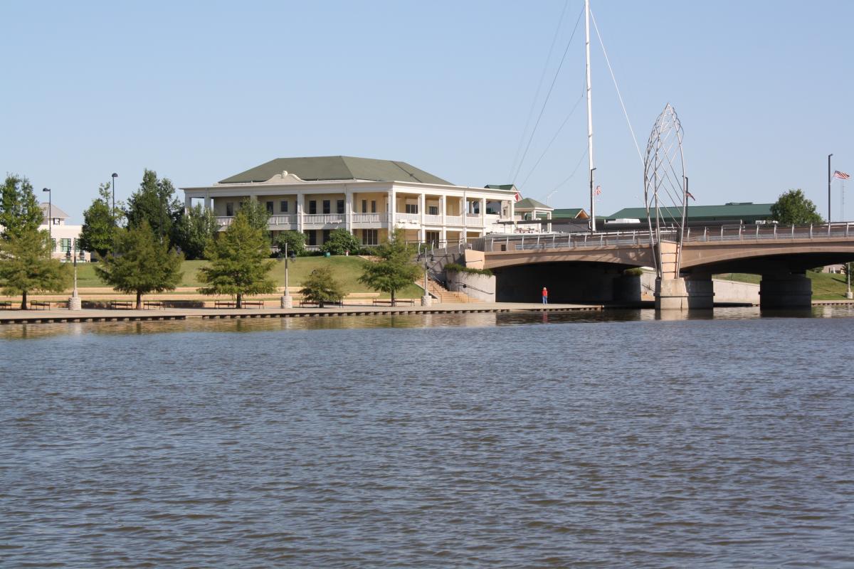 The exterior of the Wichita Boathouse located on the Arkansas River on a sunny day