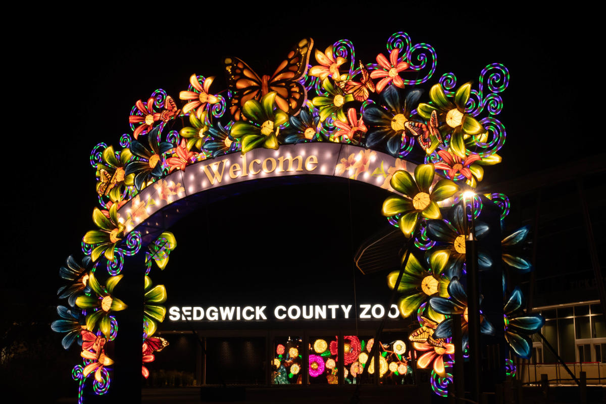 Lights adorn a sign at the entrance of the Sedgwick County Zoo during the Wild LIghts event