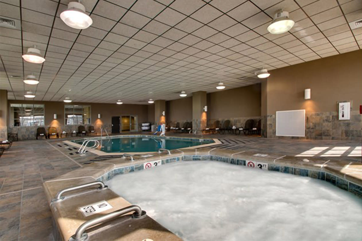Bubbles form over the top of the water in the hot tub next to the indoor pool at the Drury Plaza Hotel Broadview