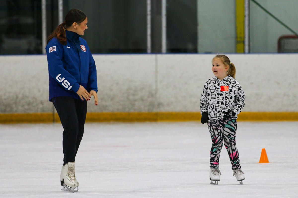 A young skater enjoys time on the ice with US Figure Skater Kaitlin Hawayek