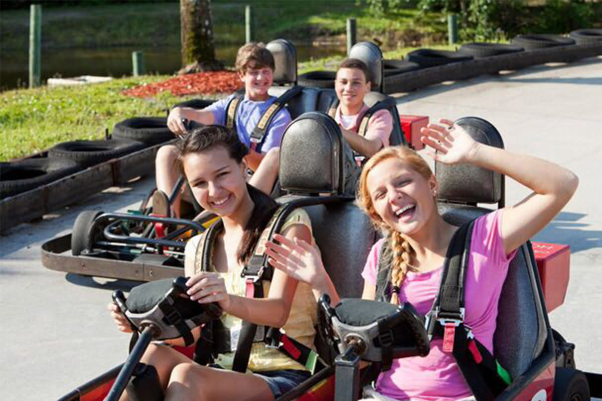 Teenagers drive go carts at All Star Adventures in east Wichita.