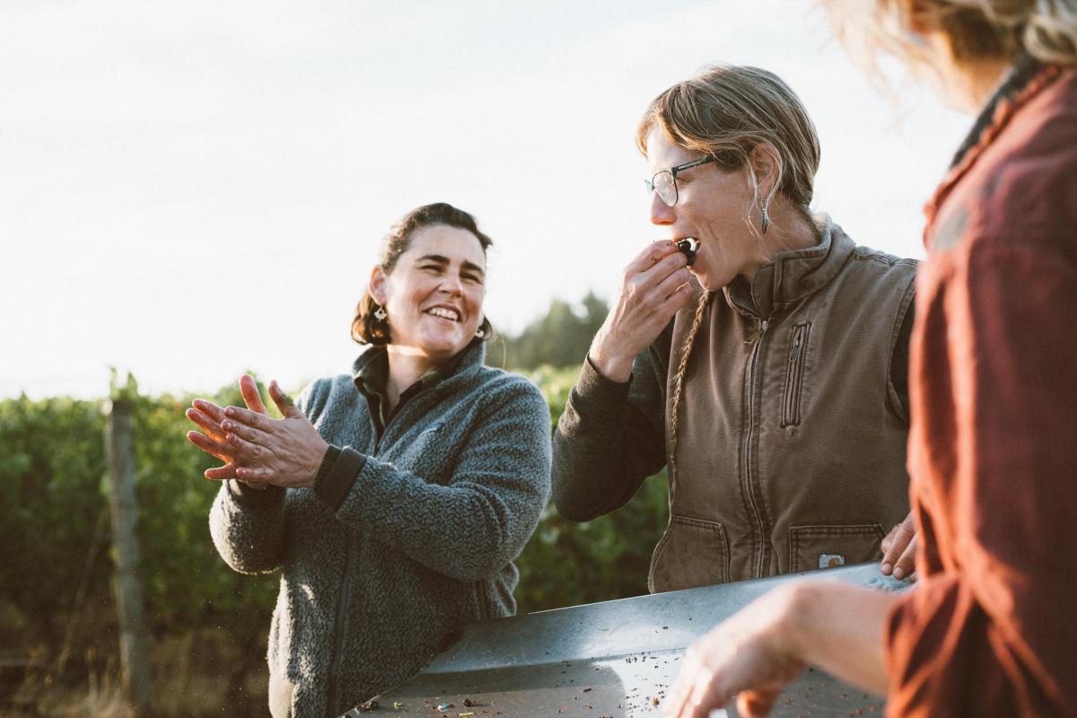 Caroline Bergstrom smiles in the vineyard while hosting friends.
