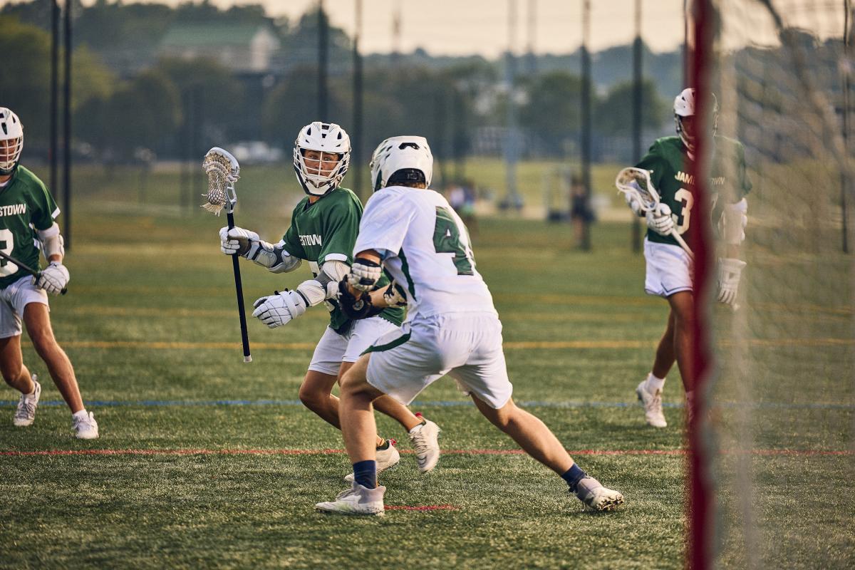Group of Boys Playing Lacrosse