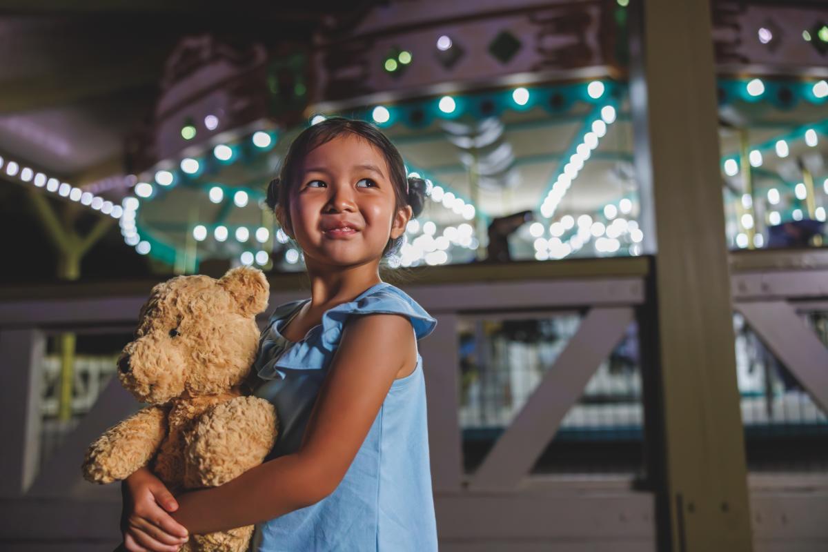 Child in front of Carousel