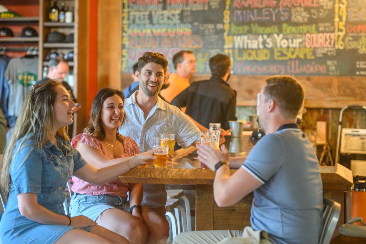 Group of young adults drinking at a brewery